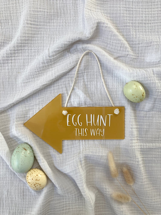 acrylic arrow hanging sign that says egg hunt this way
